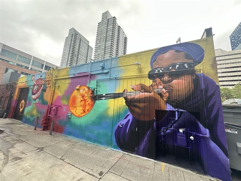Mural of Black artist glass blowing.