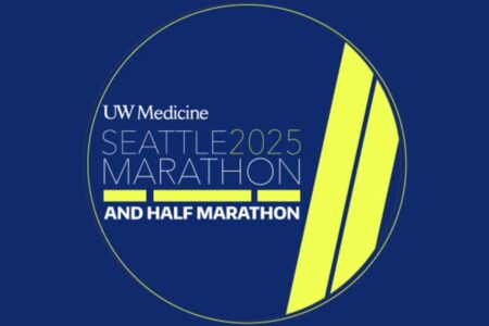 A circular logo on a dark blue background reads 