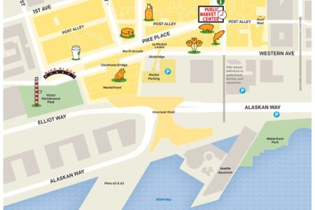 Illustrated map of Pike Place Market in Seattle, showing main streets, the market area, the iconic sign, waterfront, nearby buildings, and walking paths. Key locations like public restrooms and parking areas are marked.