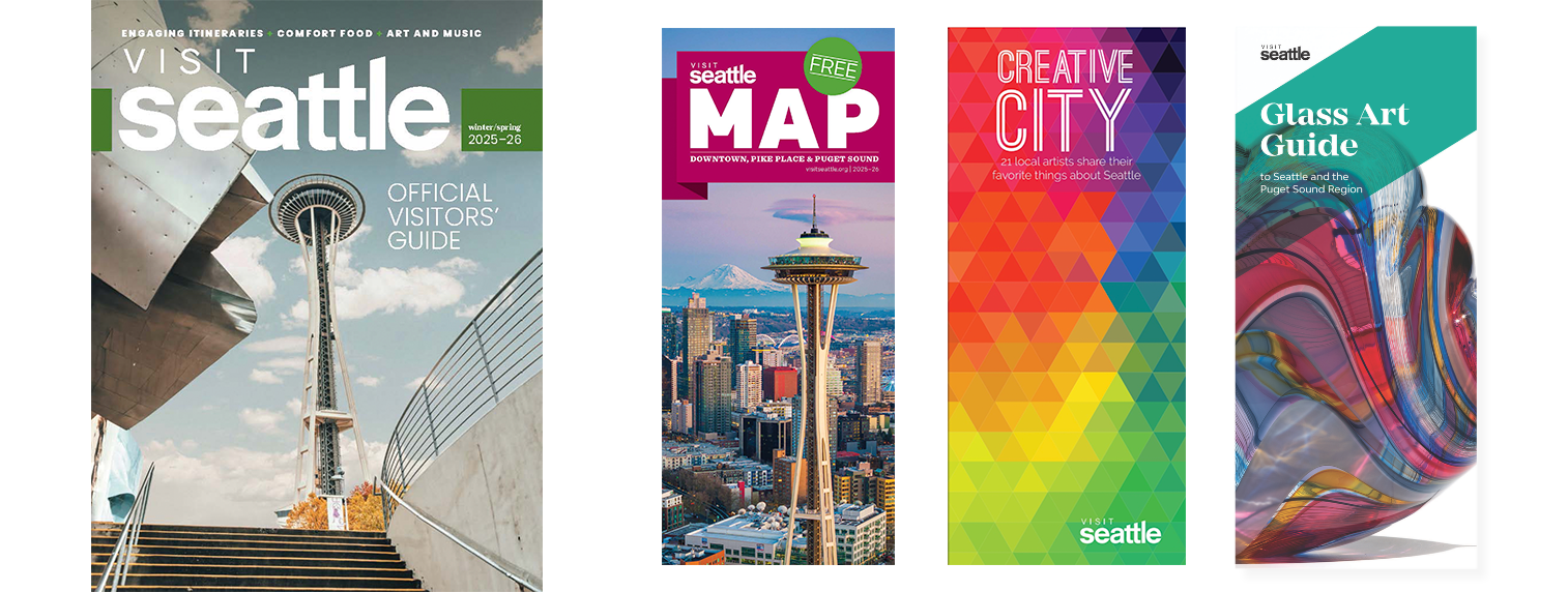 Four colorful Seattle travel brochures: one with the Space Needle, one labeled "MAP" featuring the city skyline, one titled "Creative City," and one titled "Glass Art Guide" with abstract glass artwork.